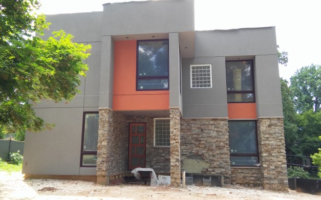 Back of the house, waiting for the final stone, planters, deck and steps.